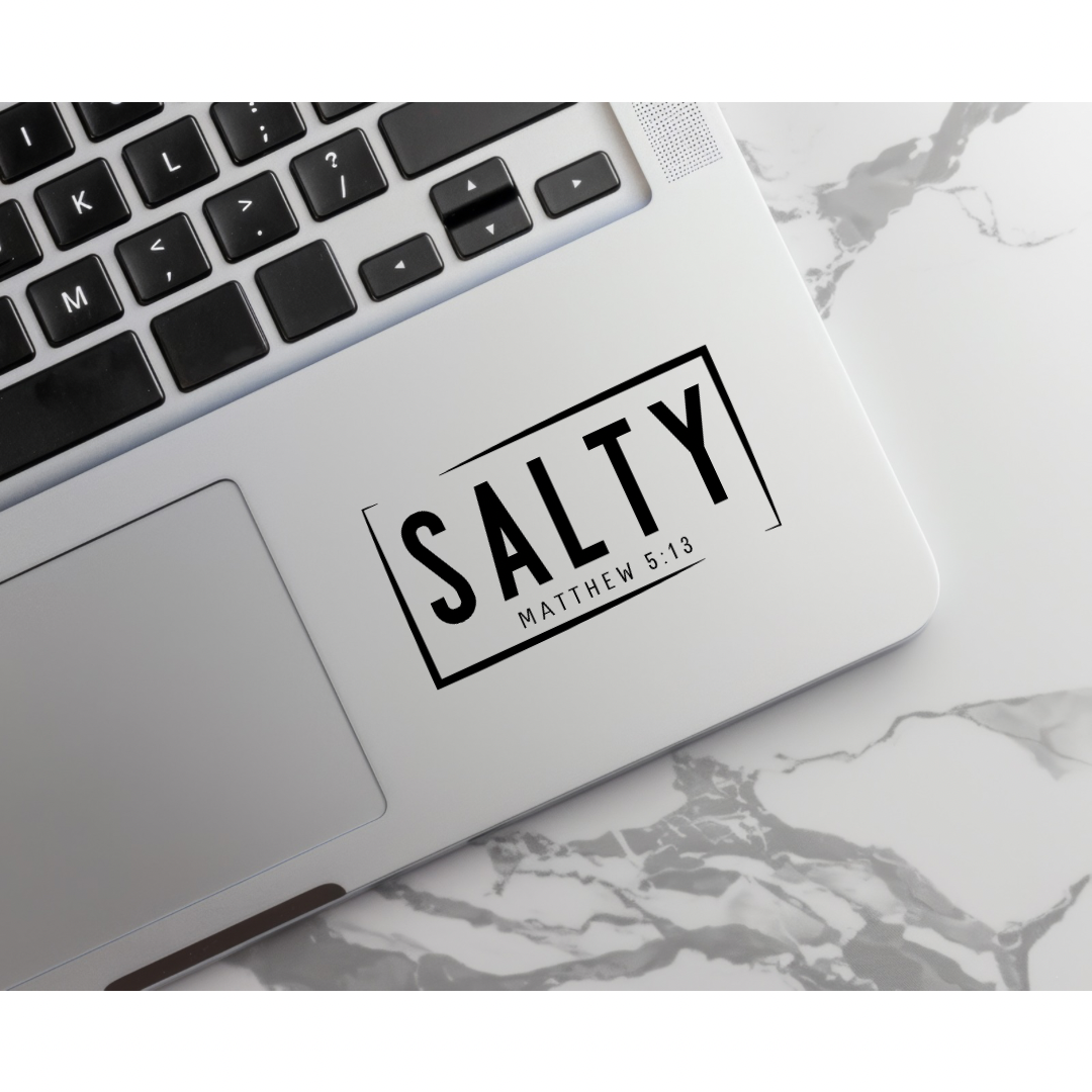 Keyboard sticker that says, “Salty Matthew 5:14.”