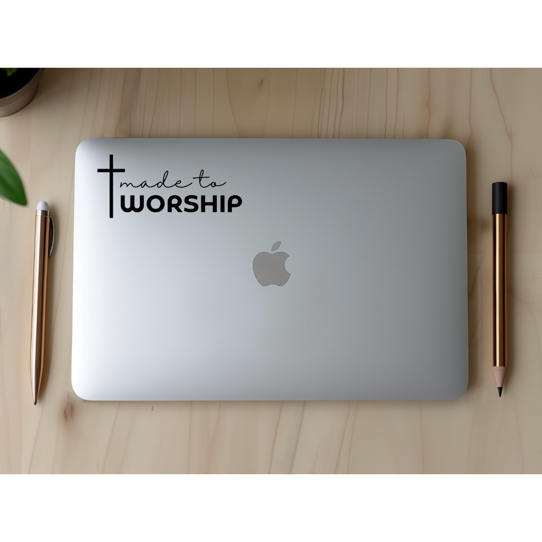 Laptop sticker that says, "made to worship" with a cross on it.