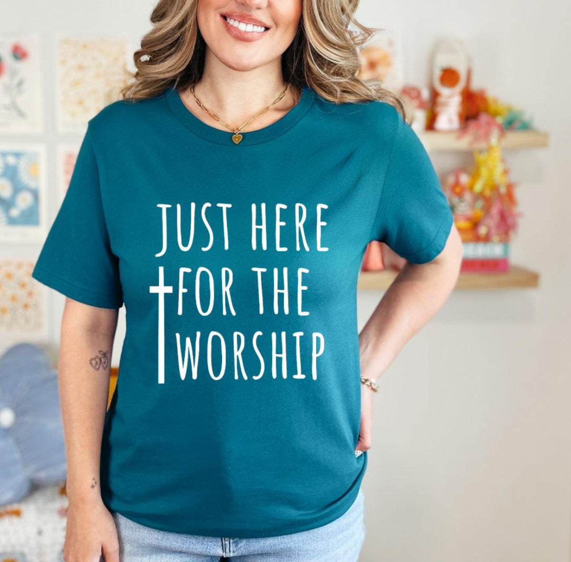 Deep teal crewneck t-shirt that says, “just here for the worship” with a cross on it.