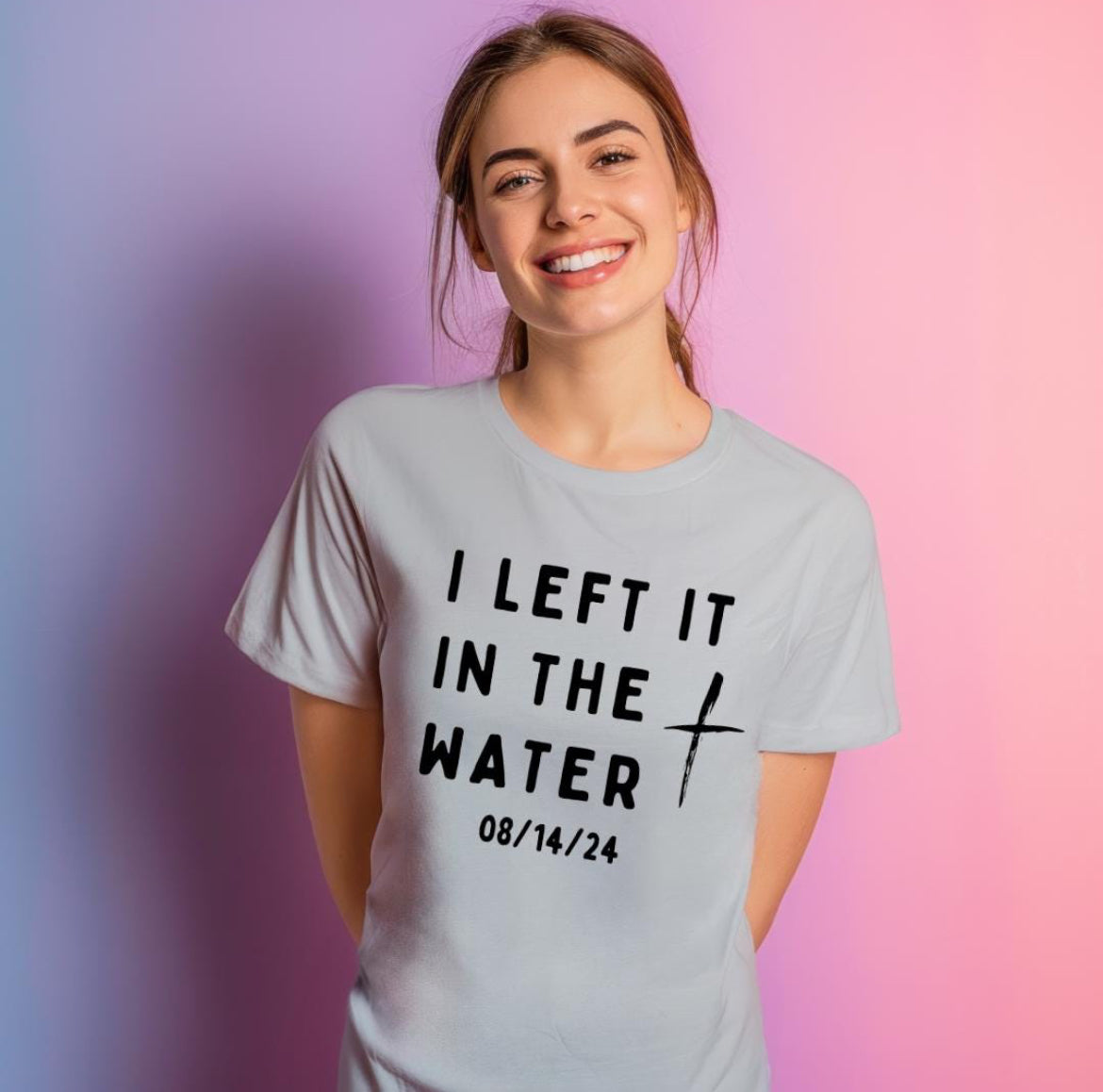 Gray crewneck t-shirt that says, “I left it in the water” with a custom baptism date underneath.