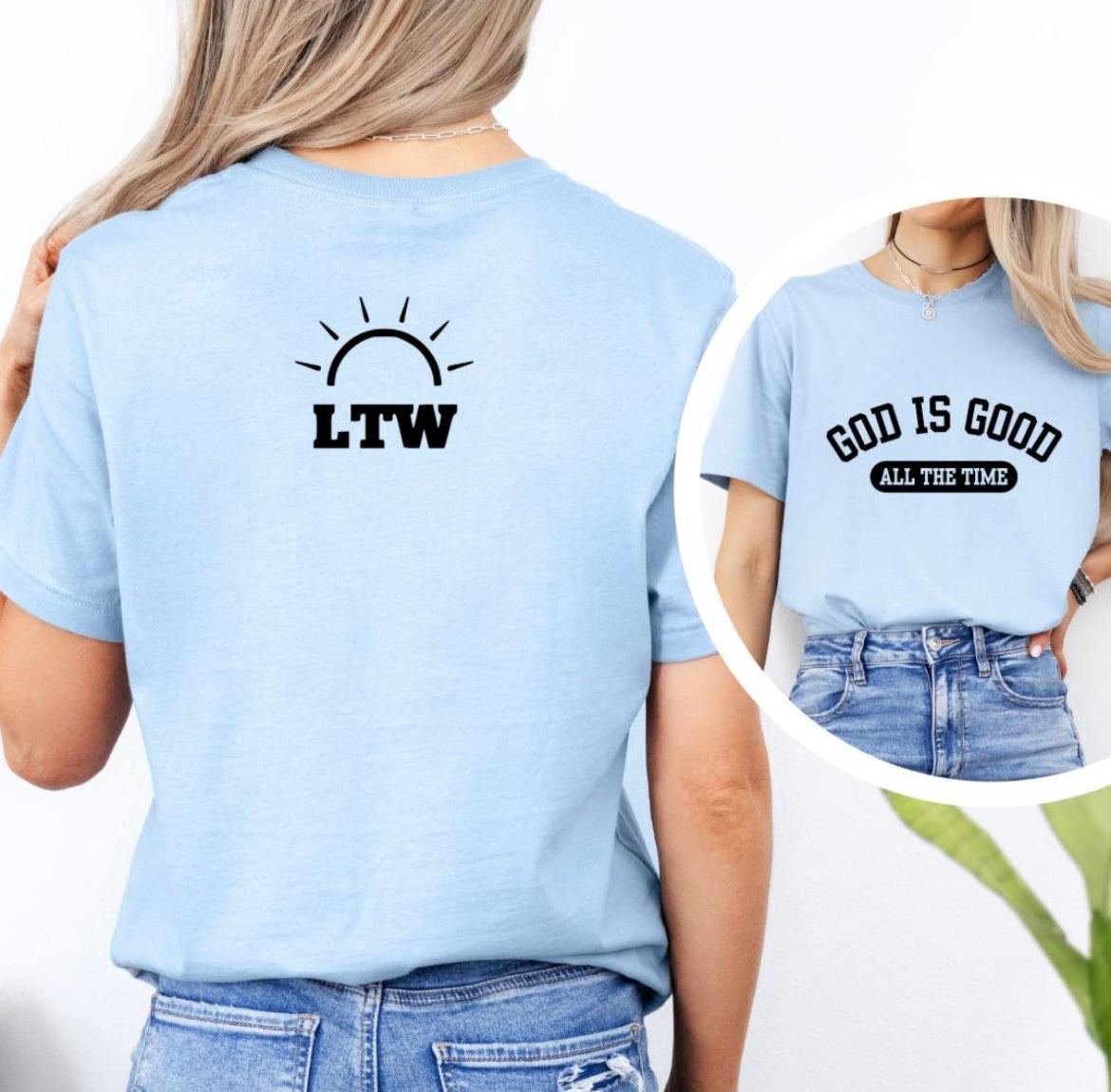 Baby blue crewneck t-shirt that says, “God is good all the time”. On the back is a logo for Light the Way nonprofit.