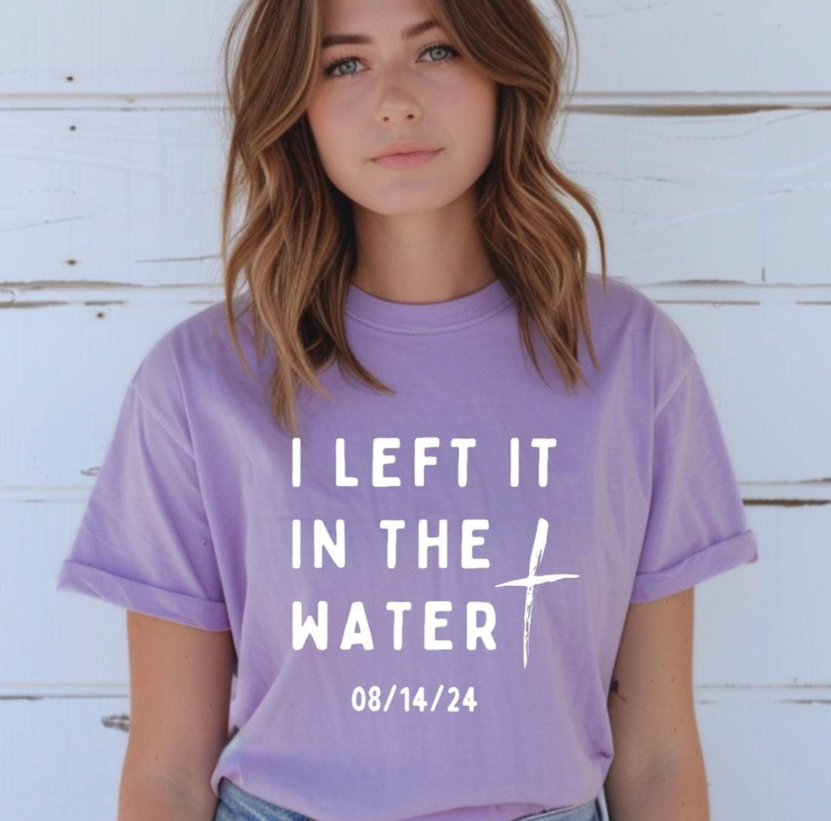Lavender crewneck t-shirt that says, “I left it in the water” with a custom baptism date underneath.