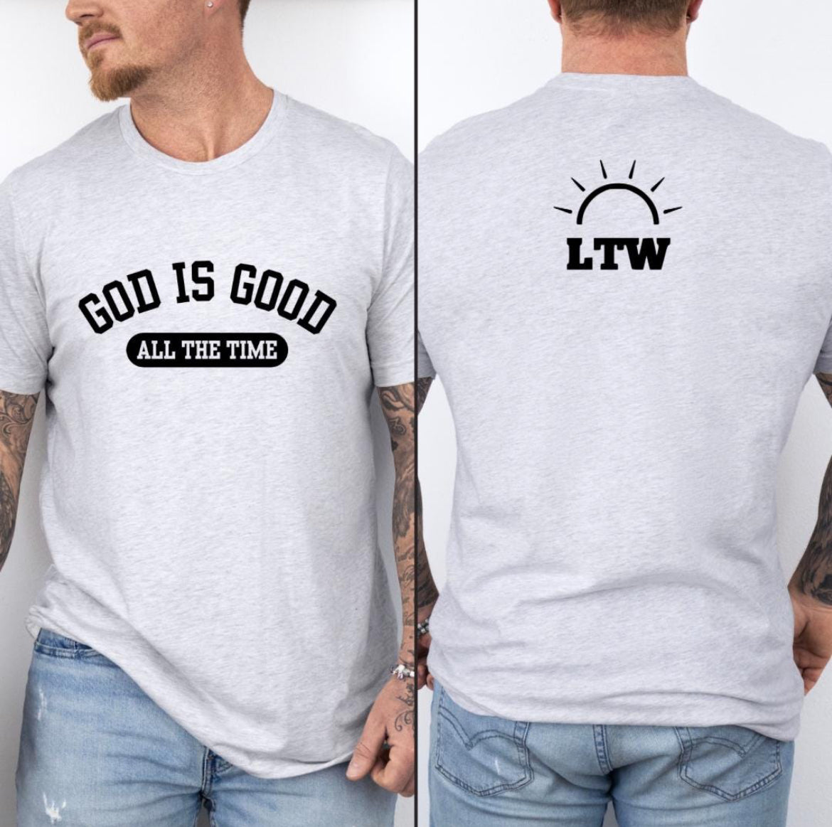 Ash white crewneck t-shirt that says, “God is good all the time”. On the back is a logo for Light the Way nonprofit.
