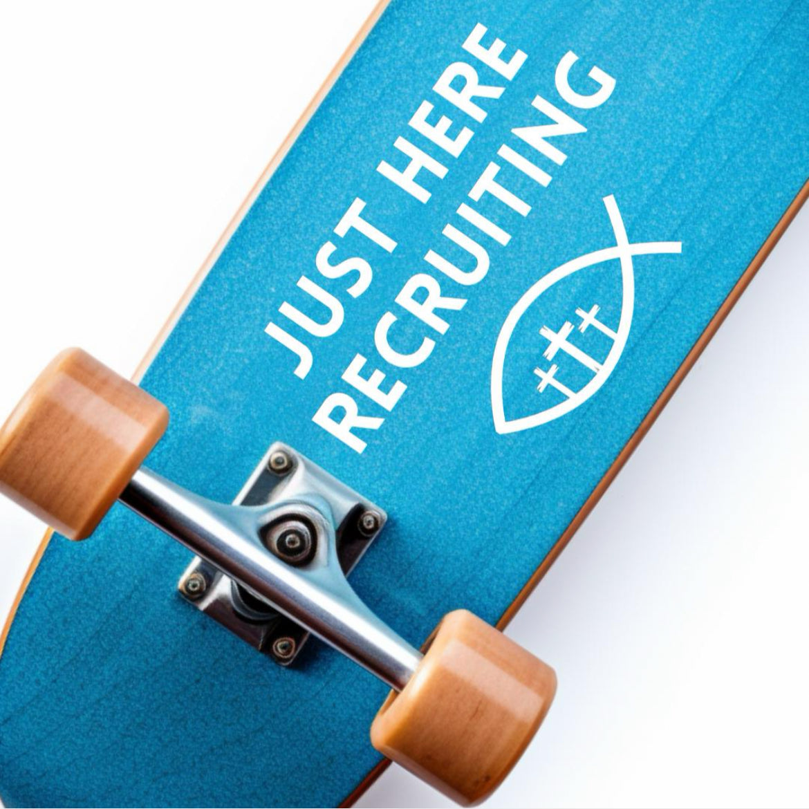 Skateboard decal sticker that says, “Just here recruiting” with the ichthus fish symbol with three crosses in the middle.