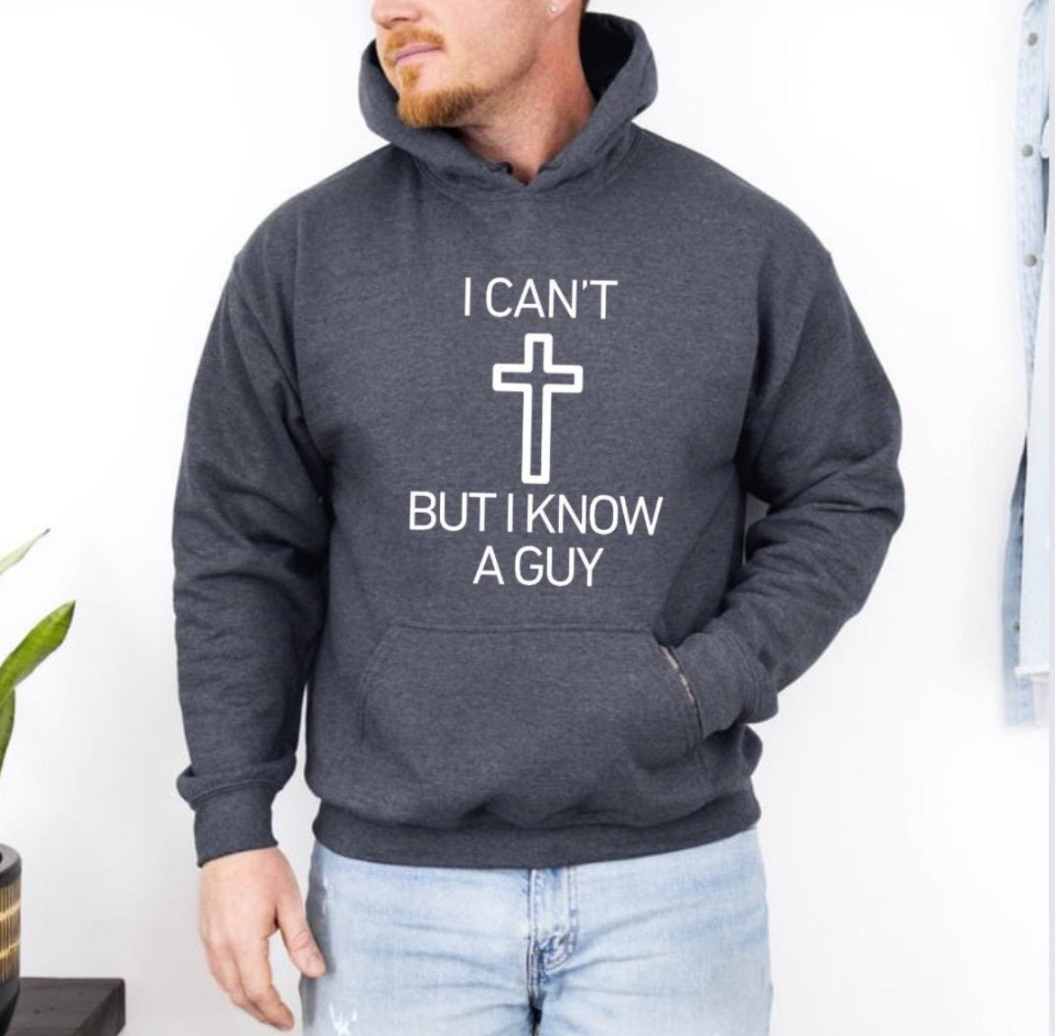 Dark gray hoodie that says, "I can't but I know a guy" with a cross in the middle.