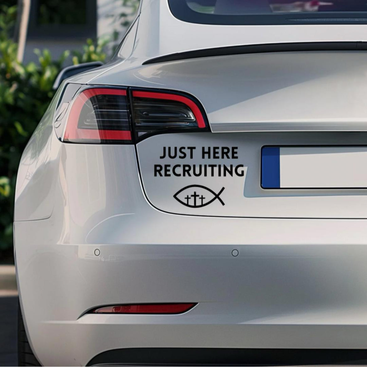 Bumper sticker car decal that says, “Just here recruiting” with the ichthus fish symbol with three crosses in the middle.