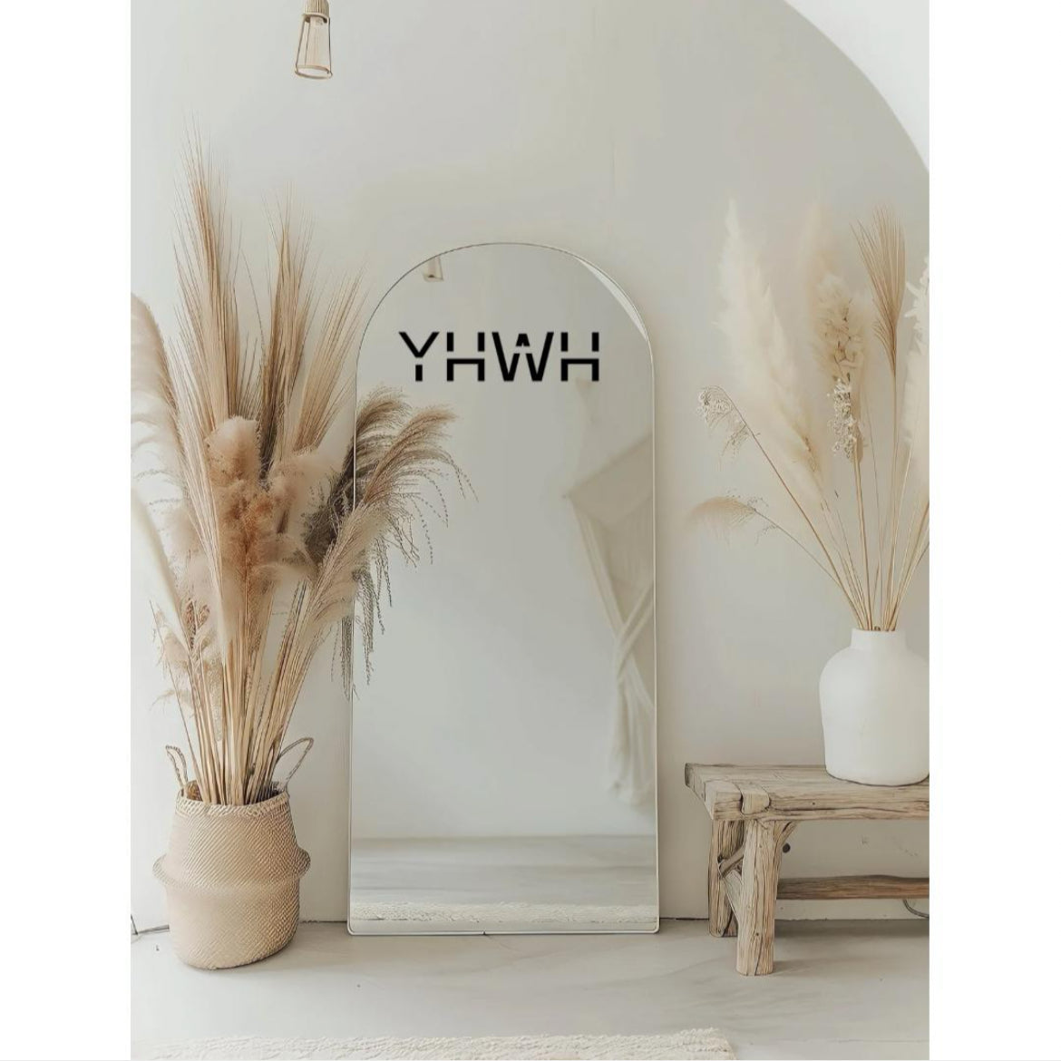 Mirror decal sticker that says, “YHWH” in large capital letters.