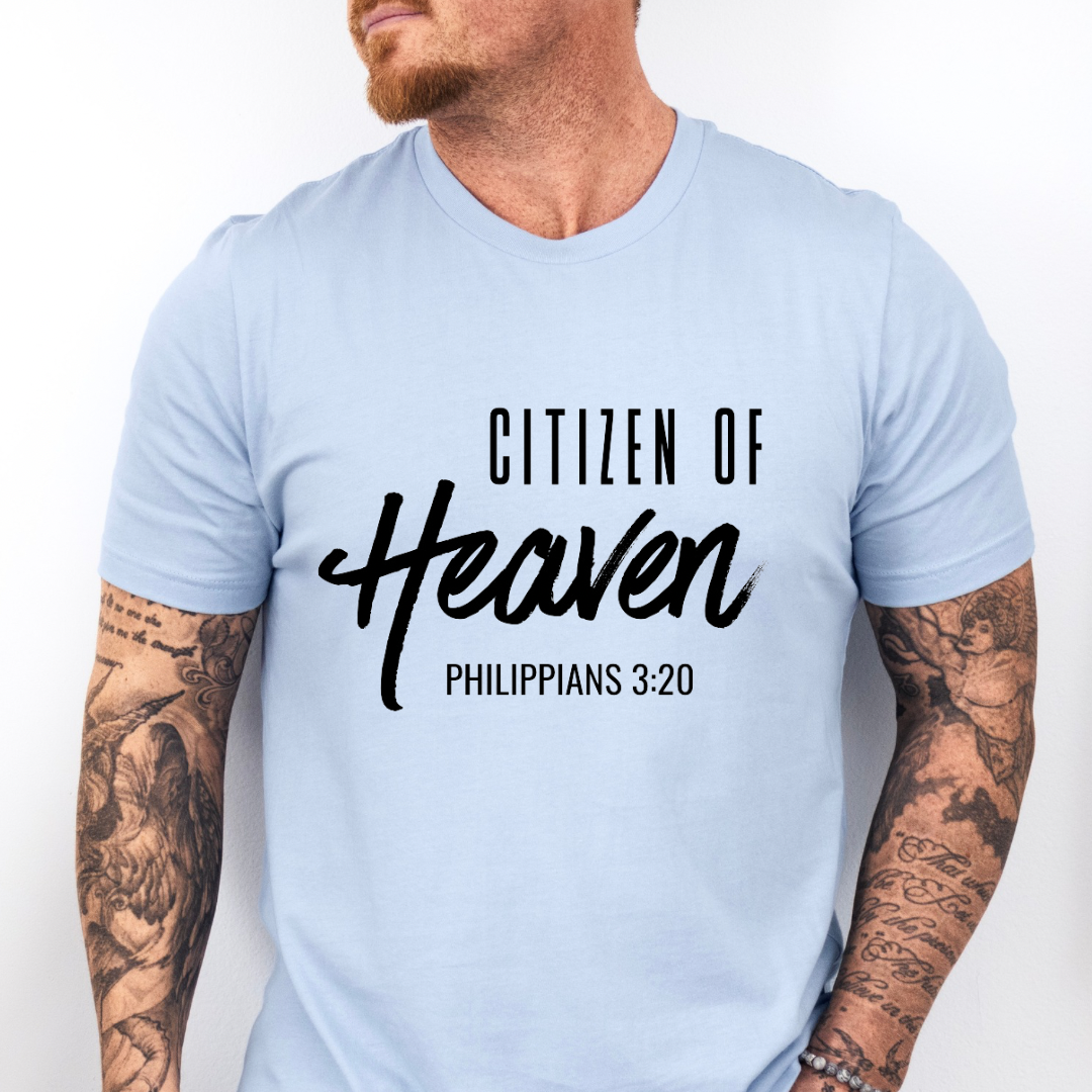 Baby blue crewneck t-shirt that says, "Citizen of Heaven". Underneath in smaller writing it says, "Philippians 3 20."