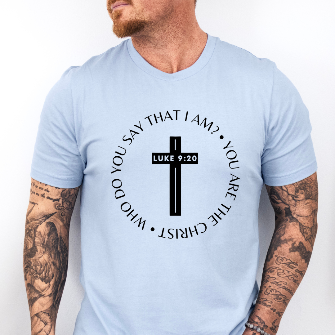 Baby blue crewneck t-shirt that says, “who do you say that I am? you are the Christ?” With a cross that says, “Luke 9:29” through the middle.