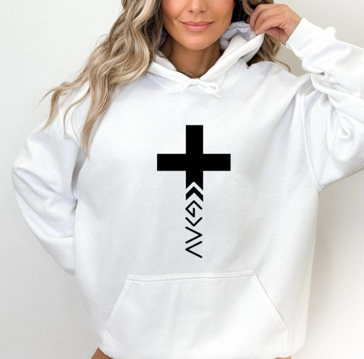 White hoodie that has a cross with the "God is greater than the highs and lows" symbol on the bottom. The same symbol is on the sleeve.