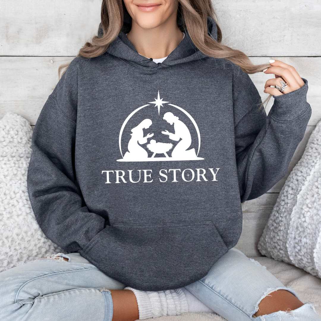 Dark heather gray Christmas sweatshirt that says, "true story" featuring Jesus, Mary and Jesus in a manger.