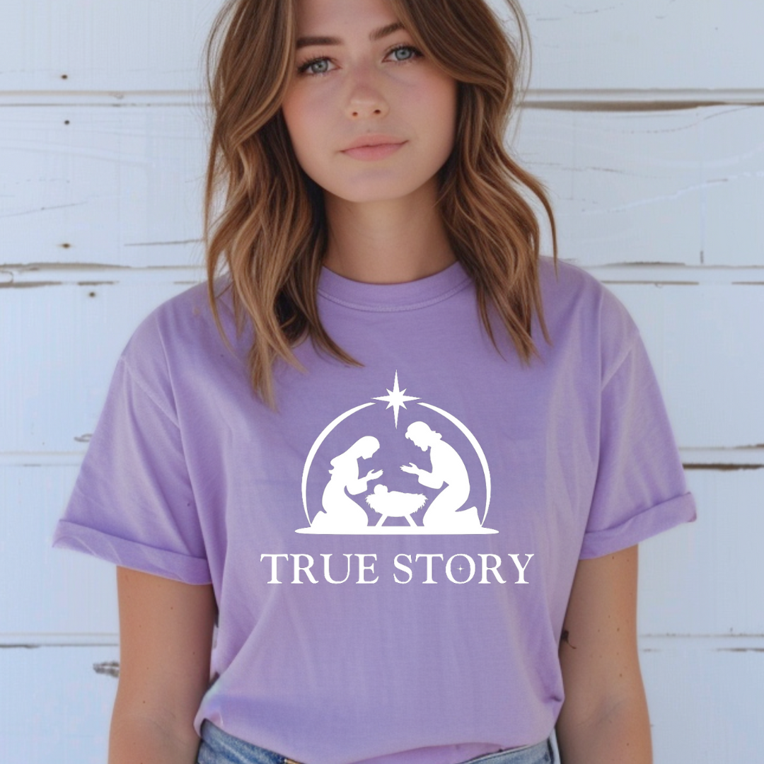 Lavender crewneck t-shirt that says, “true story” with Mary, Joseph and baby Jesus in a manger. Christian Christmas Holiday attire.