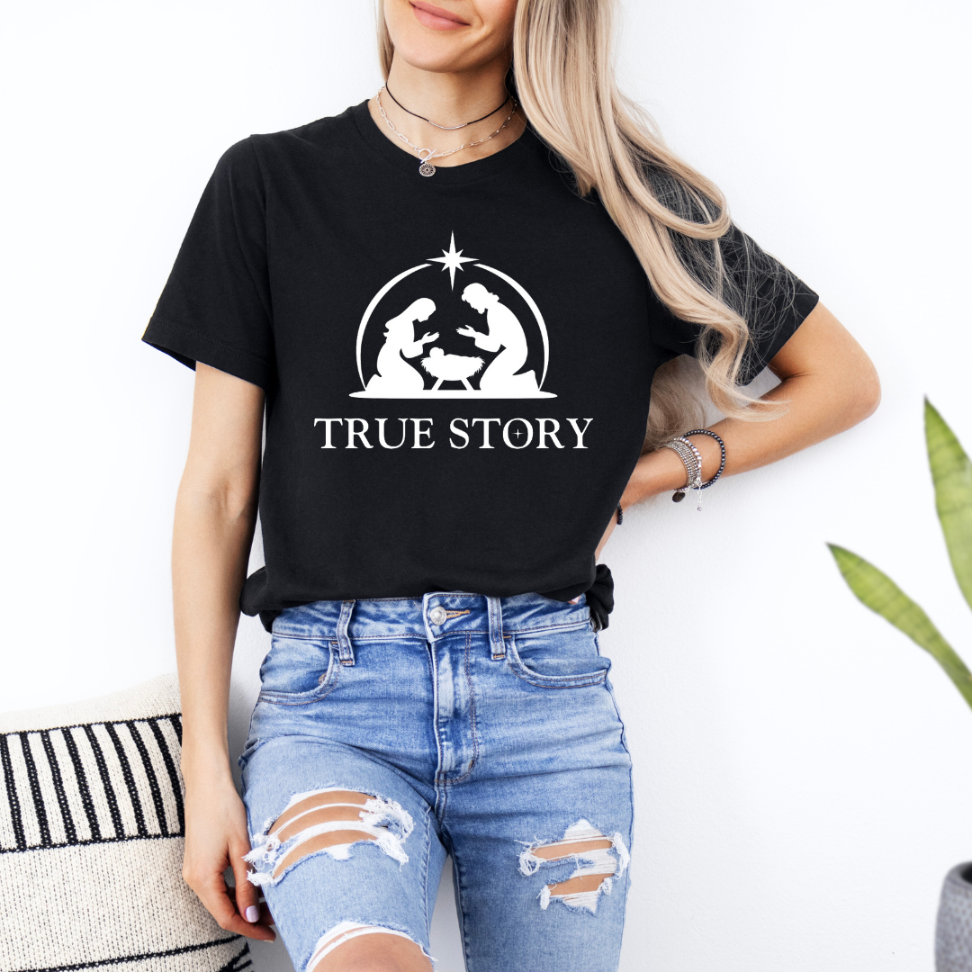 Black crewneck t-shirt that says, “true story” with Mary, Joseph and baby Jesus in a manger. Christian Christmas Holiday attire.