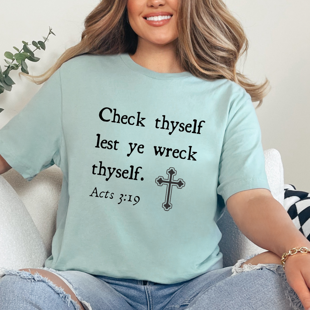 Dusty green crewneck t-shirt that says, "Check thyself lest ye wreck thyself. Acts 3:19" with a vintage cross graphic.