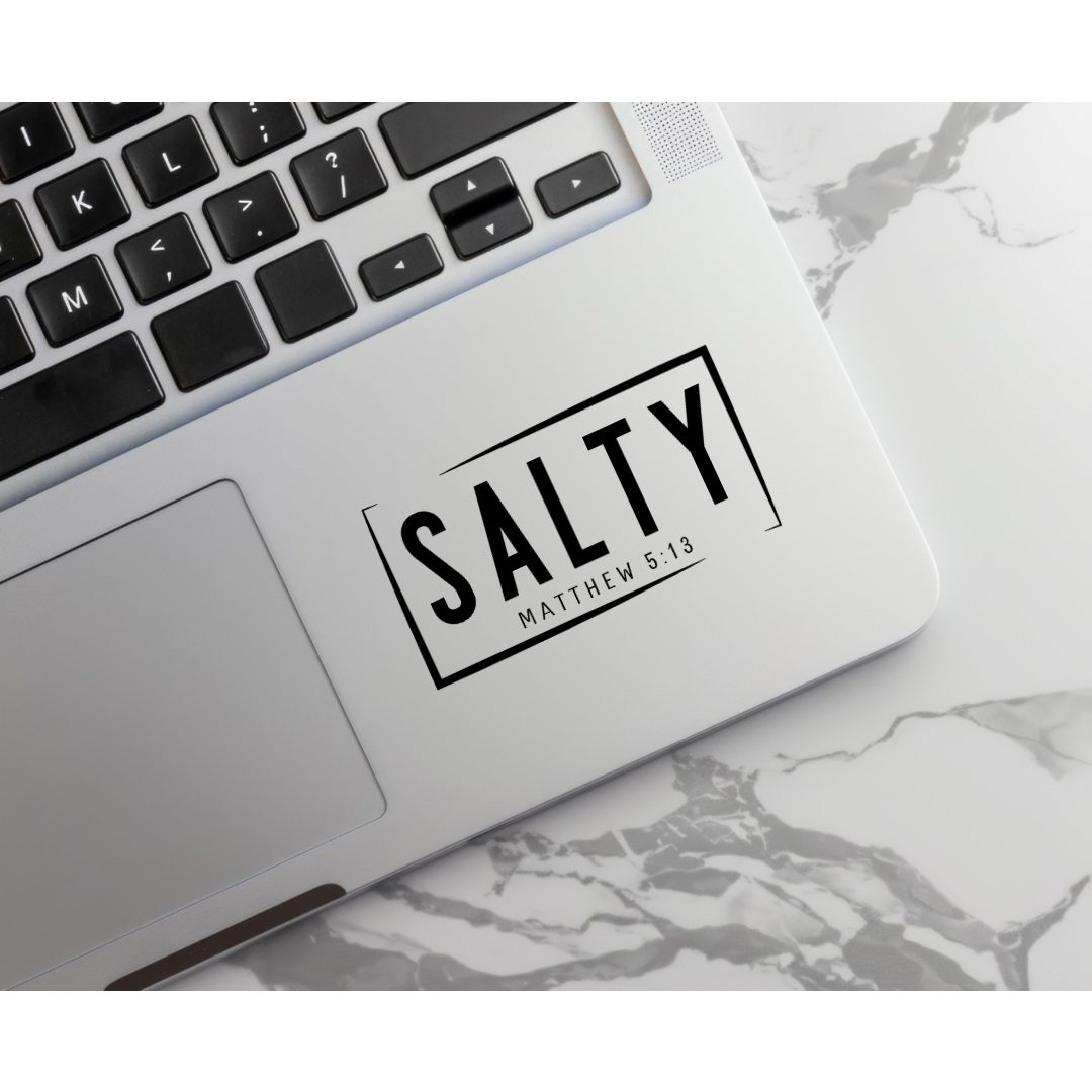 Keyboard sticker that says, “Salty Matthew 5:14.” 