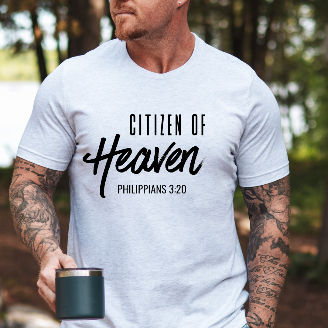 Ash white crewneck t-shirt that says, "Citizen of Heaven". Underneath in smaller writing it says, "Philippians 3 20."