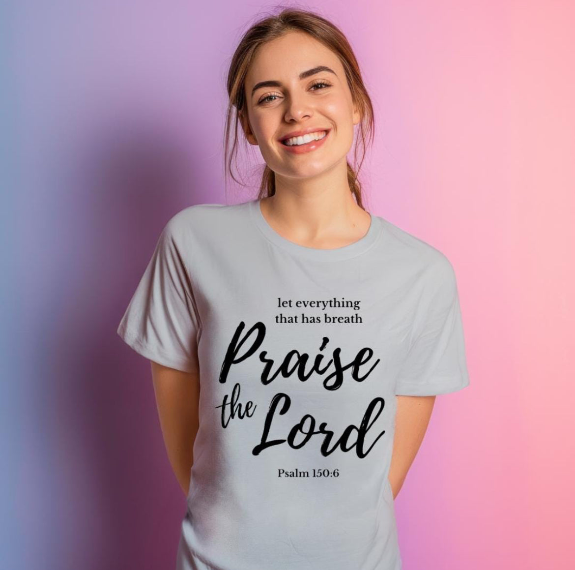 Gray crewneck t-shirt that says, “let everything that has breath praise the Lord” underneath in small letters it says, “Psalm 150 6.”