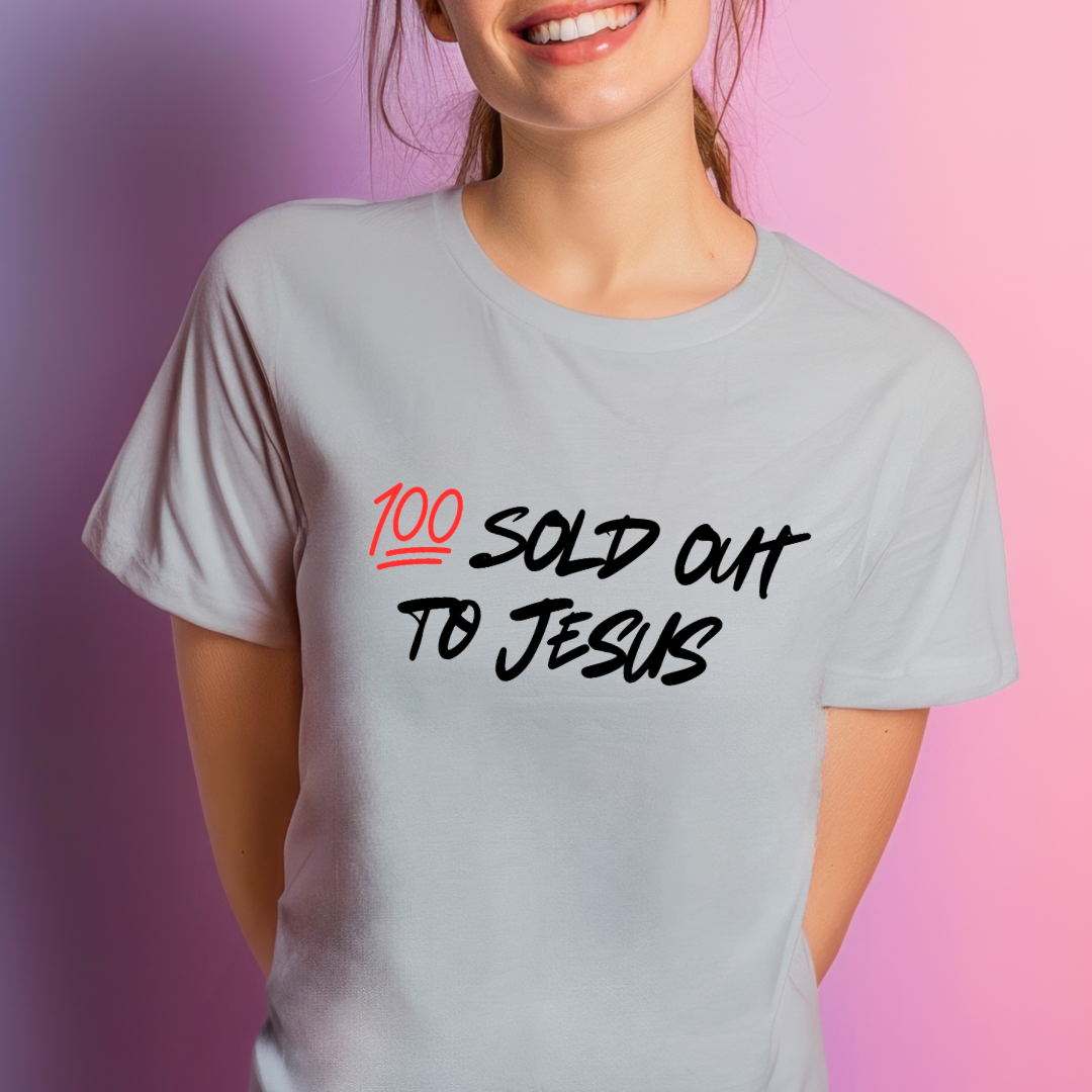 Ash white crewneck t-shirt that says, “sold out to Jesus” with a “100 emoji”.