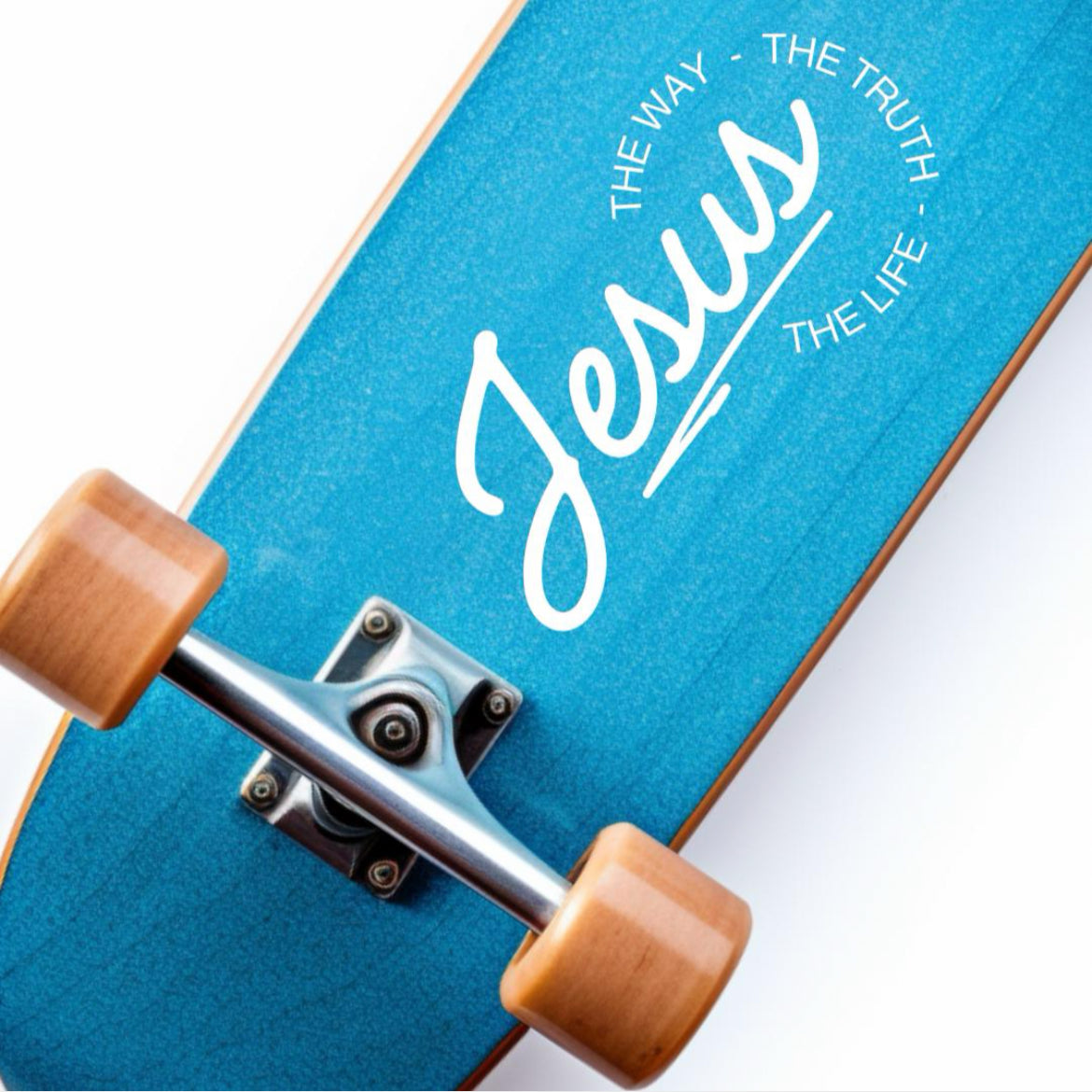 Skateboard sticker decal that says, “Jesus - the way, the truth, the life.” The word “Jesus” is in large cursive letters. The other words are in print and round the ending of “Jesus”.