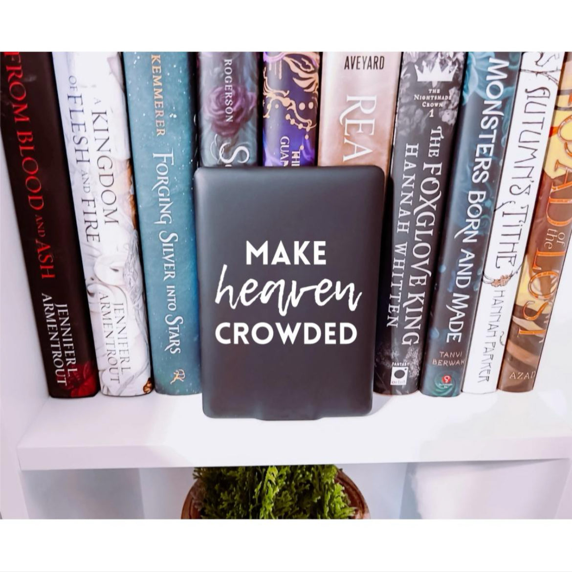 Kindle sticker decal that says, “make heaven crowded.” The word “heaven” is in cursive. 