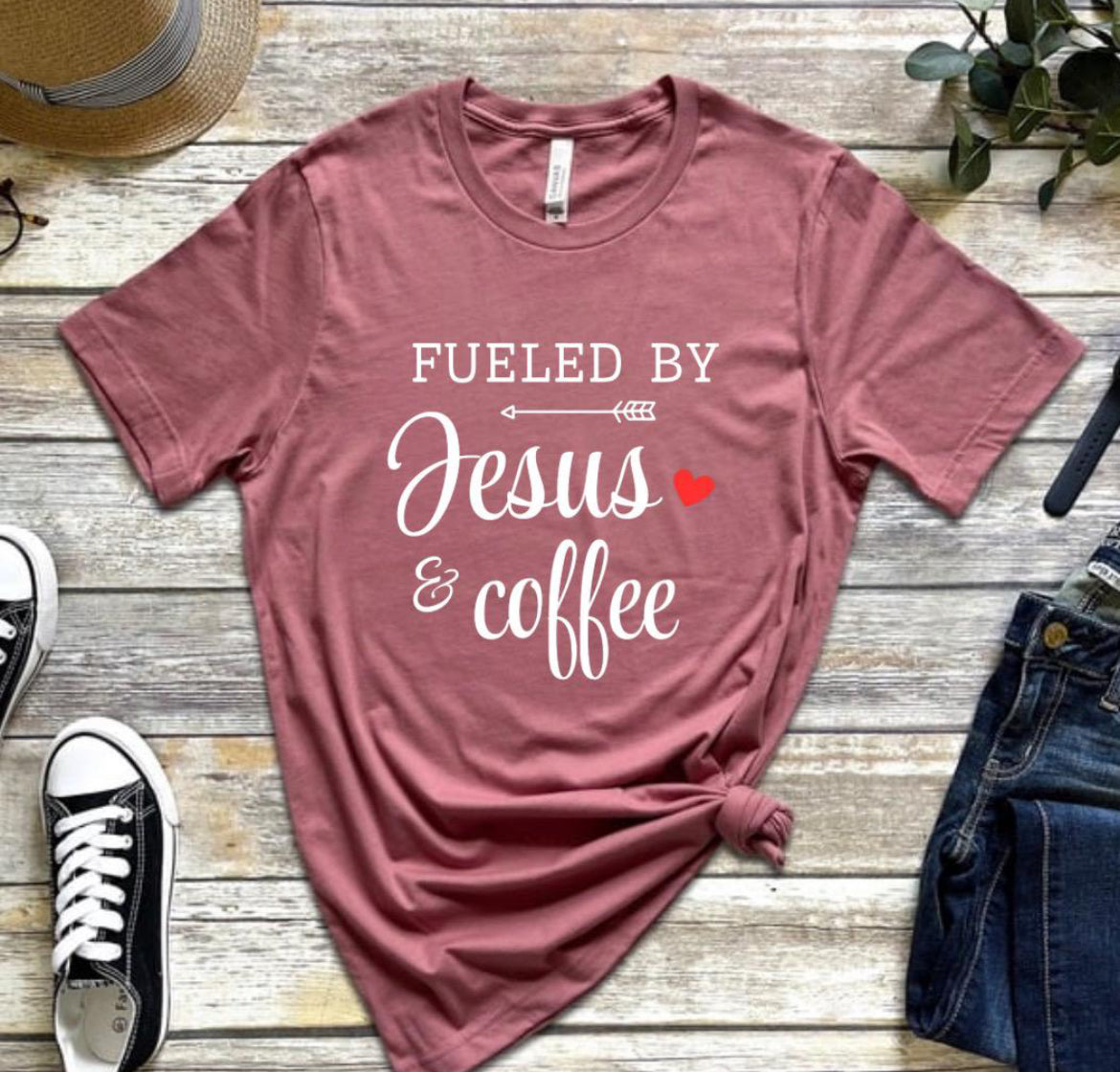 Mauve crewneck t-shirt that says, “fueled by Jesus and coffee.”