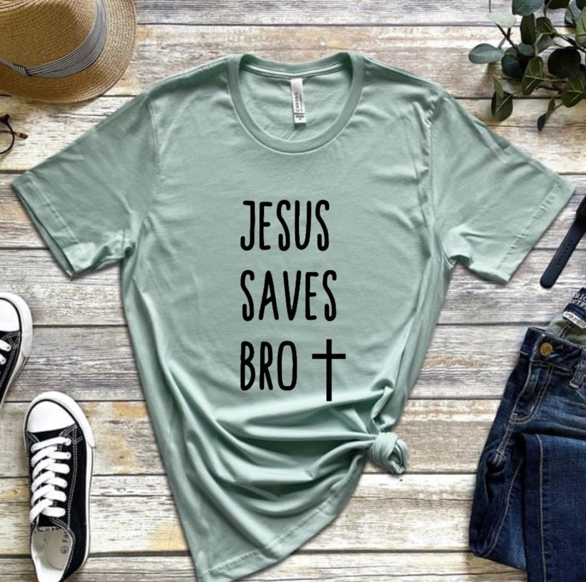 Dusty green crewneck t-shirt that says, “Jesus saves bro” with a cross. 