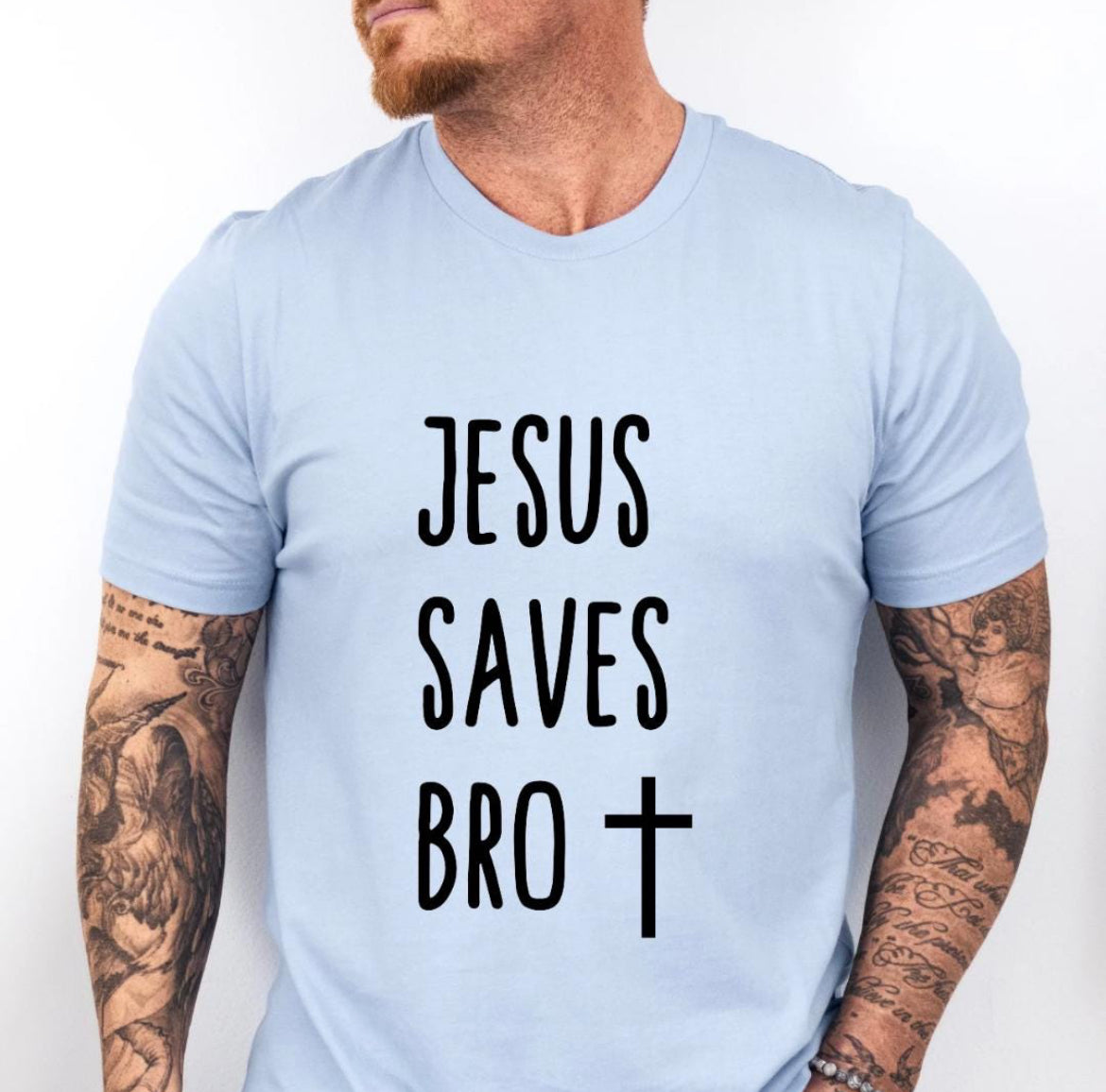 Baby blue crewneck t-shirt that says, “Jesus saves bro” with a cross. 