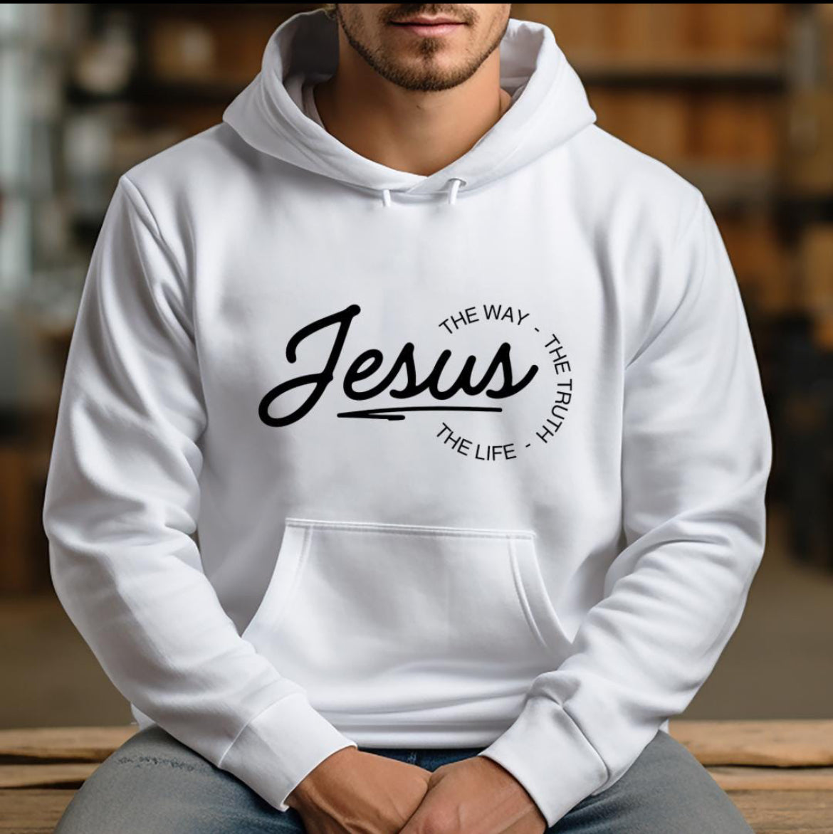 White hoodie that says, "Jesus, the way, the truth, the life." 