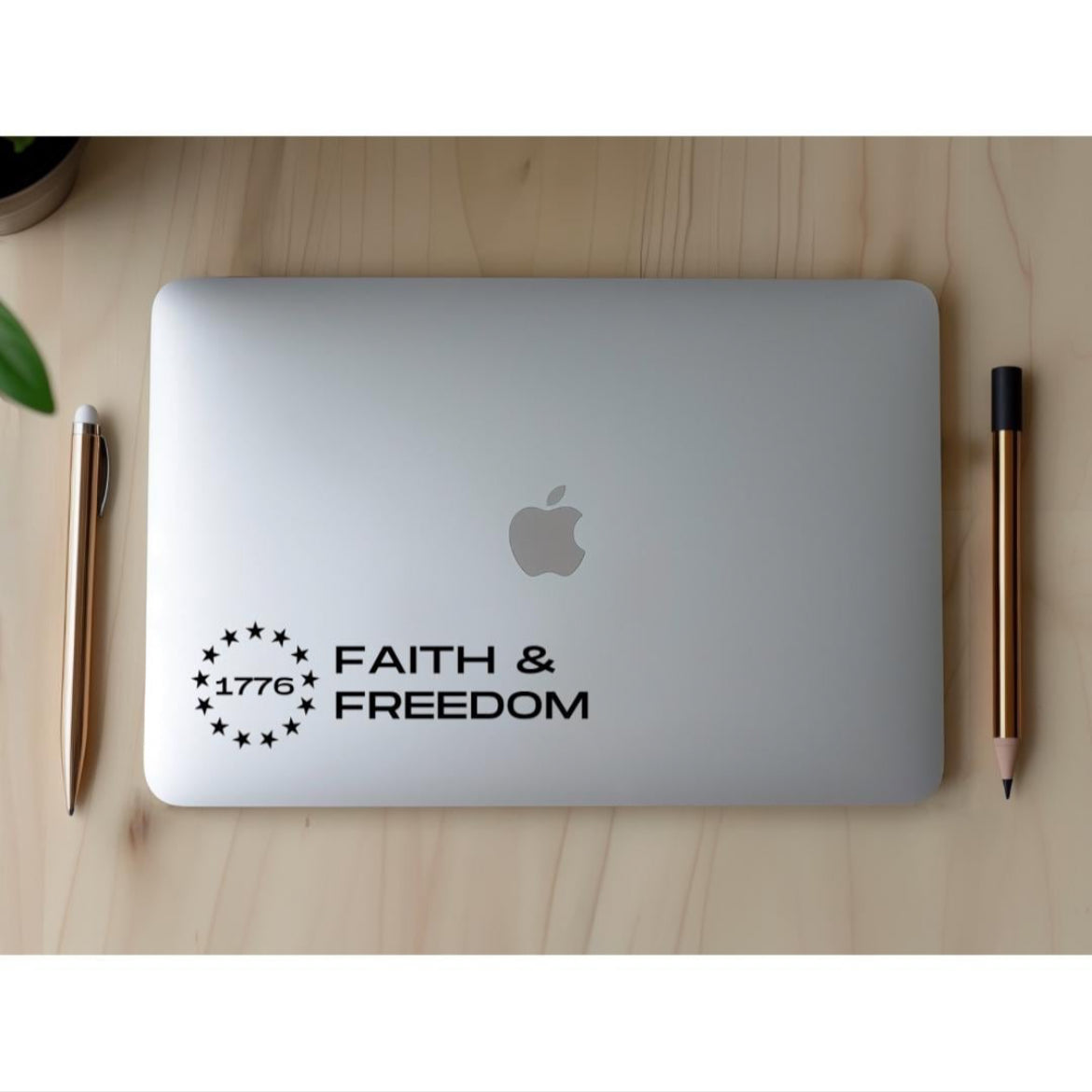 Laptop sticker decal that says, “Faith and freedom” with the Betsy Ross flag stars symbol. In the middle of the stars it says, “1776.”