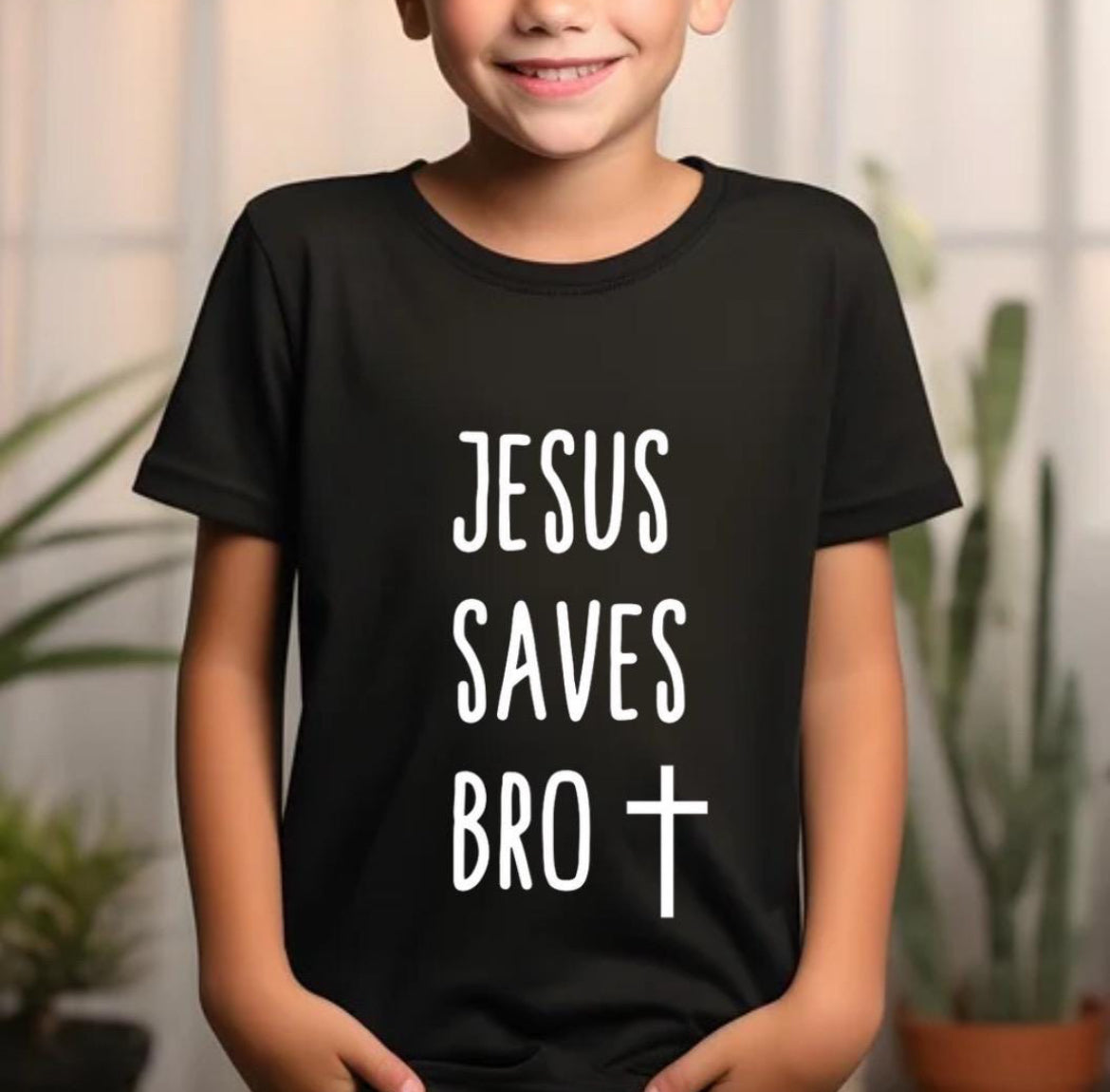 Black crewneck t-shirt that says, “Jesus saves bro” with a cross. The writing is white.