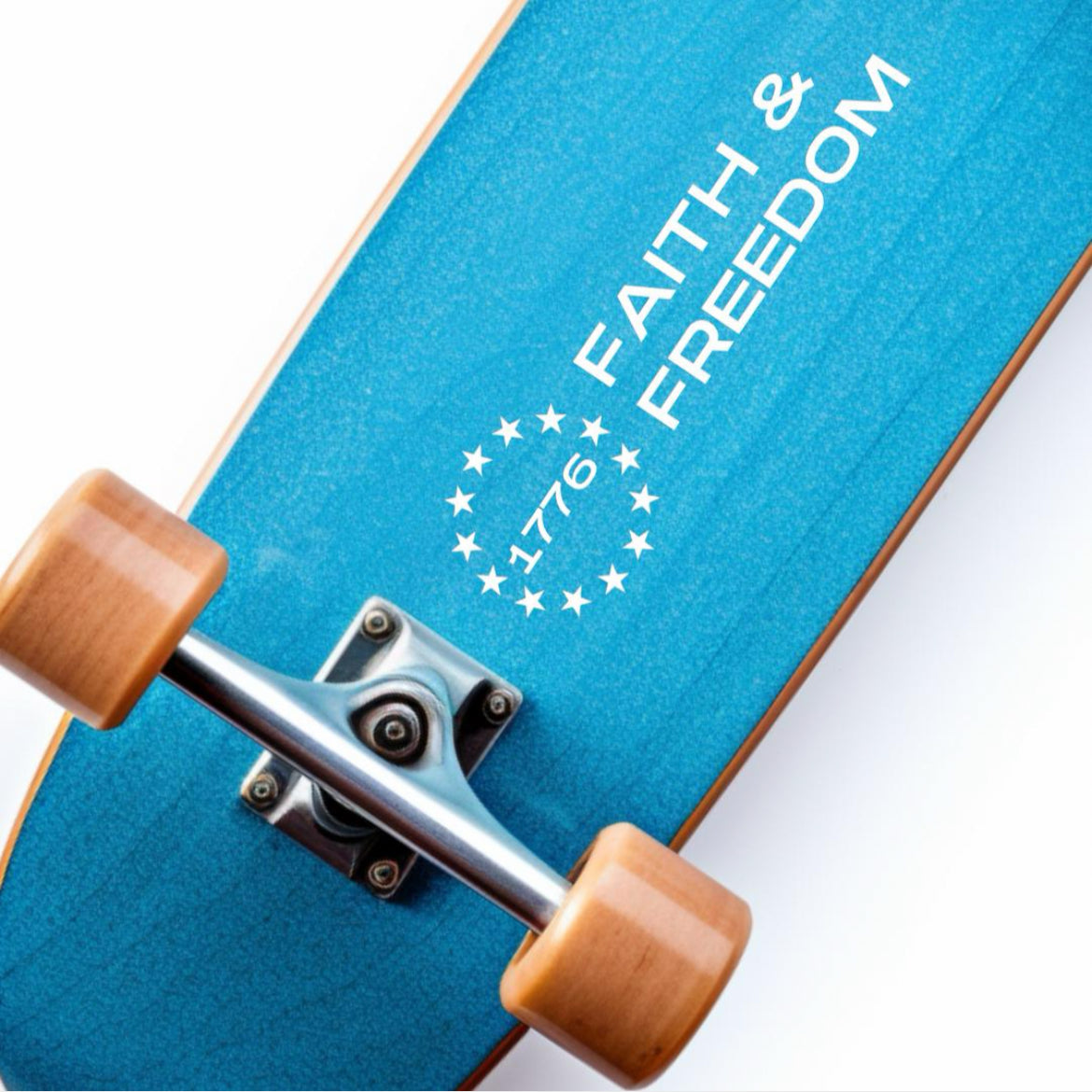 Skateboard sticker decal that says, “Faith and freedom” with the Betsy Ross flag stars symbol. In the middle of the stars it says, “1776.”