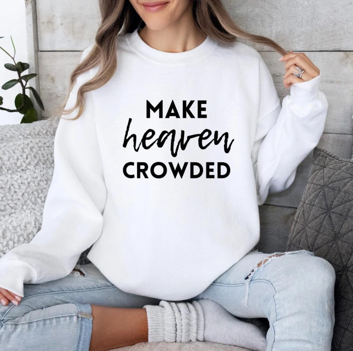 White crewneck sweatshirt that says, "Make heaven crowded."