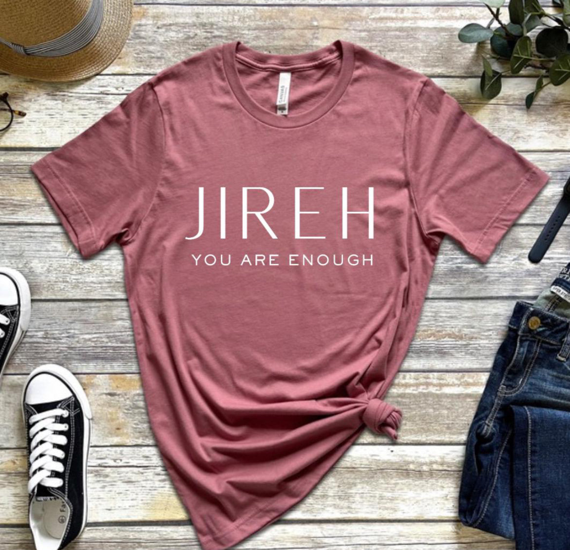 Mauve crewneck t-shirt that says, “jireh” in large letters. Underneath it says, “you are enough.”