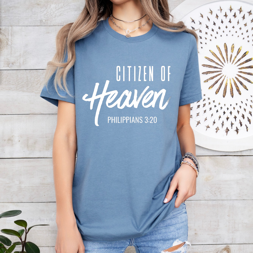 Steel blue crewneck t-shirt that says, "Citizen of Heaven". Underneath in smaller writing it says, "Philippians 3 20."