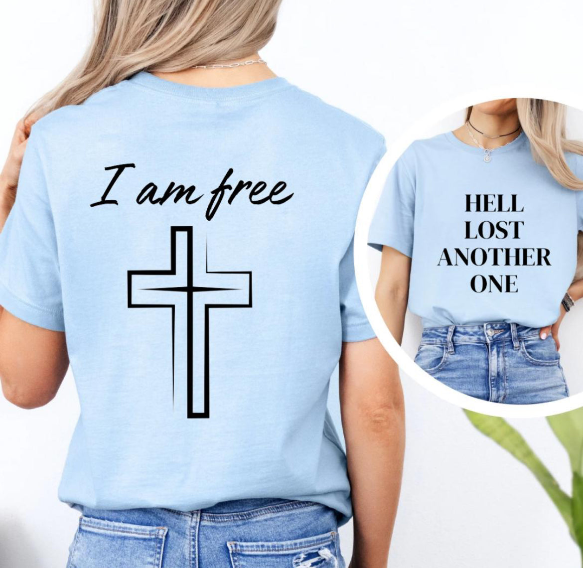 Baby blue crewneck t-shirt that says, “Hell lost another one.” The back says, “I am free” with a cross image. 