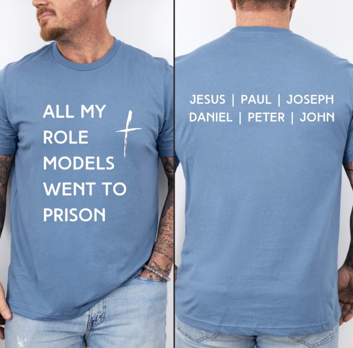 Steel blue crewneck t-shirt that says, “all my role models went to prison” with a cross. The back says, “Jesus, Paul, Joseph, Daniel, Peter, John.”