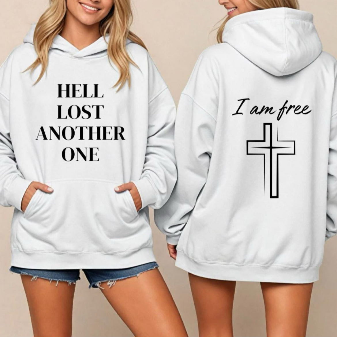 White hoodie that says, "Hell lost another one" on the front. On the back it says, "I am free" with a large cross. 