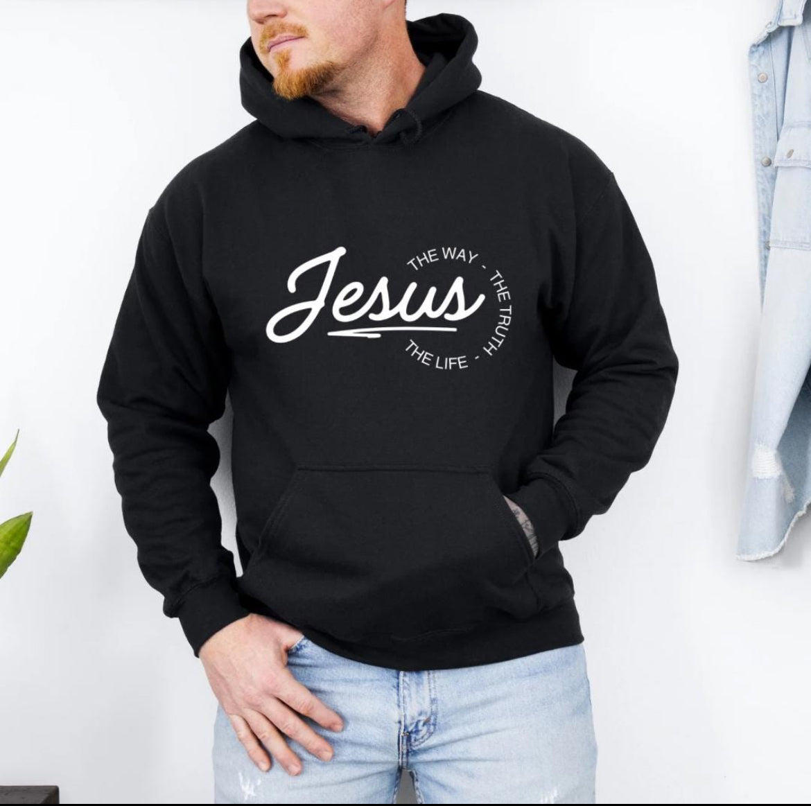 Black hoodie that says, "Jesus, the way, the truth, the life." 