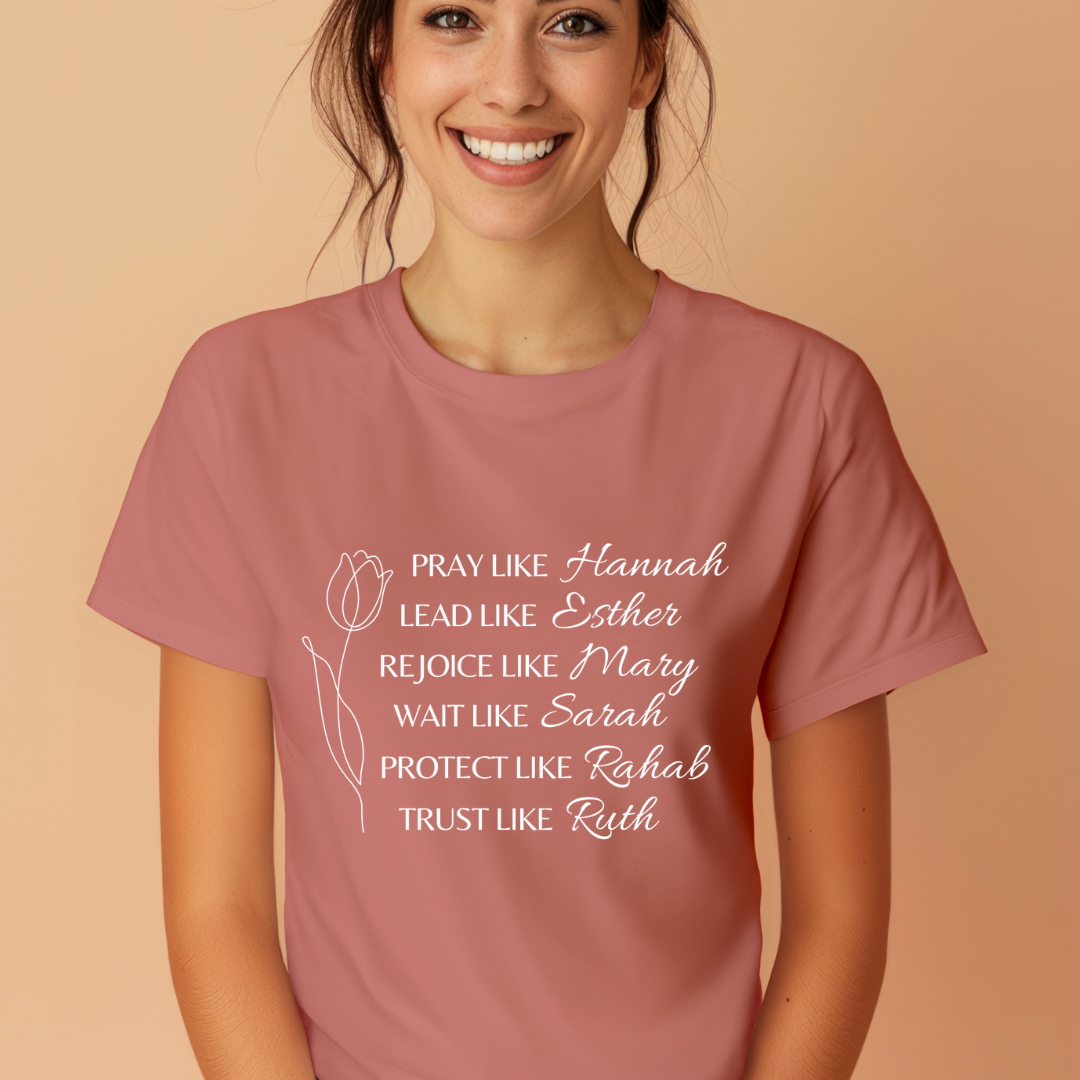 Mauve crewneck t-shirt that says, "Pray like Hannah, lead like Esther, rejoice like Mary, wait like Sarah, protect like Rahab, trust like Ruth."