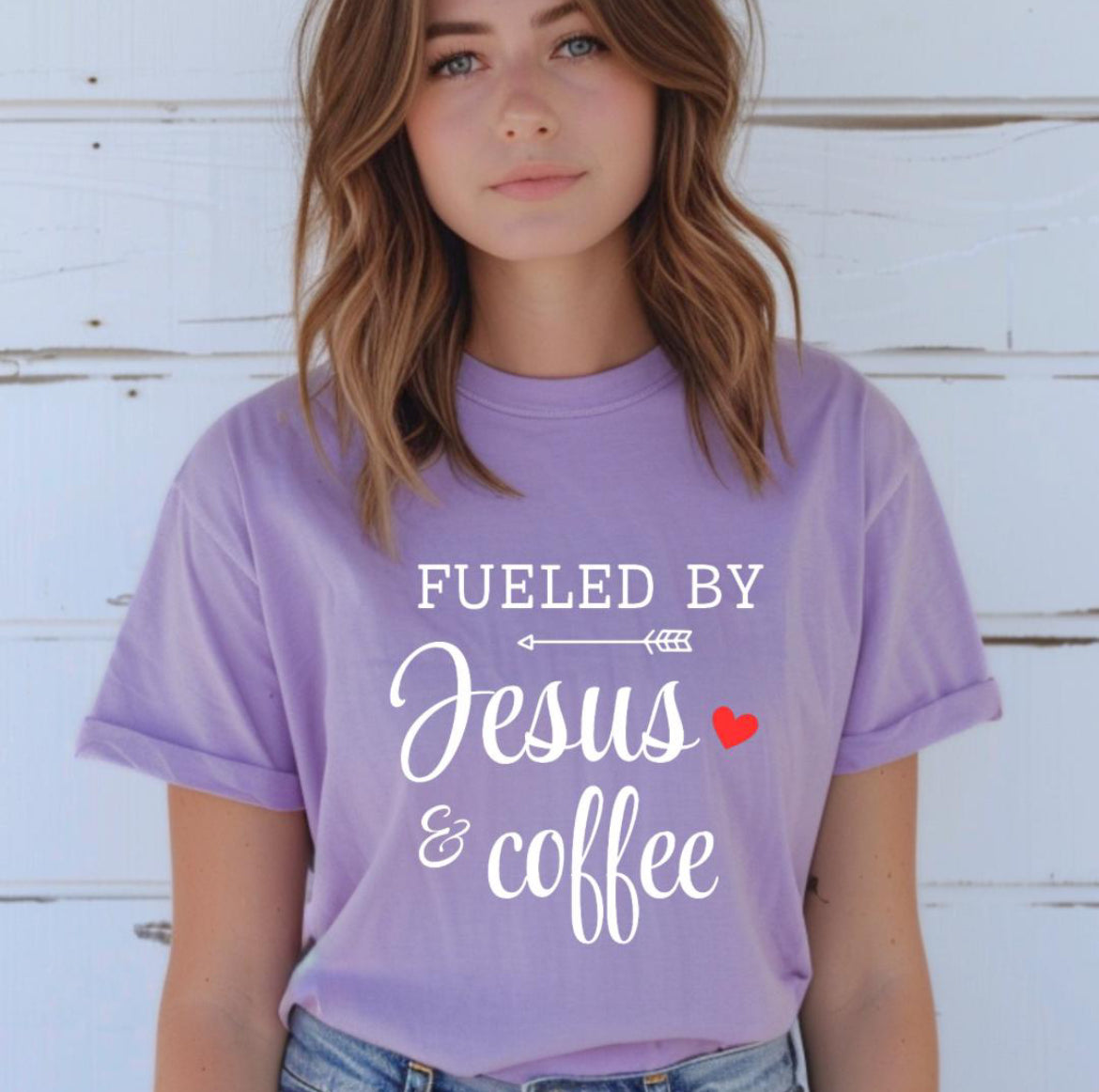 Lavender crewneck t-shirt that says, “fueled by Jesus and coffee.”