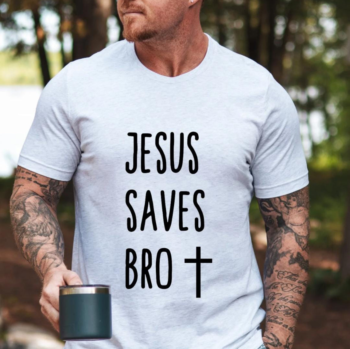 Ash white crewneck t-shirt that says, “Jesus saves bro” with a cross. 