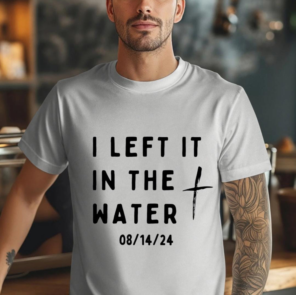 Grey crewneck t-shirt that says, “I left it in the water” with a custom baptism date underneath. 