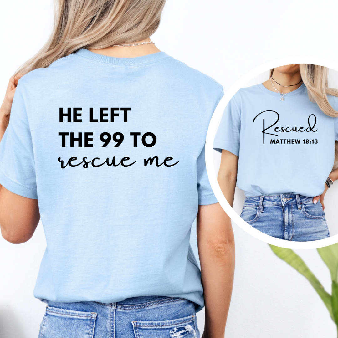 crewneck T-Shirt that says, "He left the 99 to rescue me". On the front it says, "Matthew 18:13 rescued" with a tan sheep.