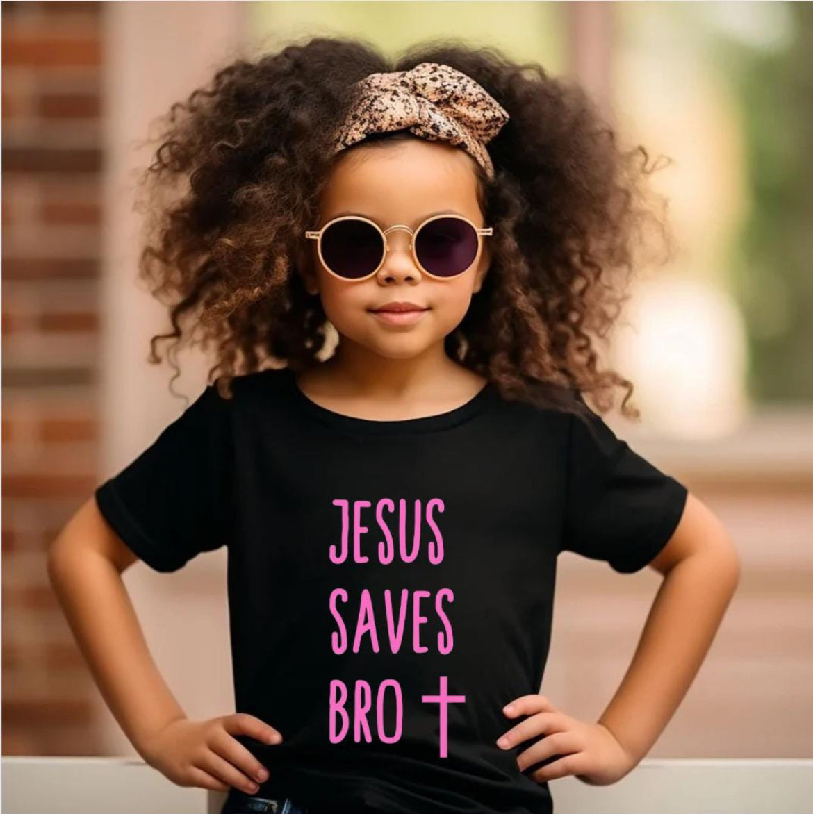 Black crewneck t-shirt that says, “Jesus saves bro” with a cross. The writing is pink.