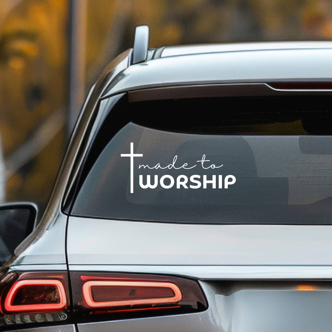 Car decal that says, "made to worship" with a cross on it. 