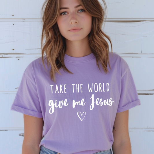 Lavender crewneck t-shirt that says, “take the world, give me Jesus” with a heart graphic.