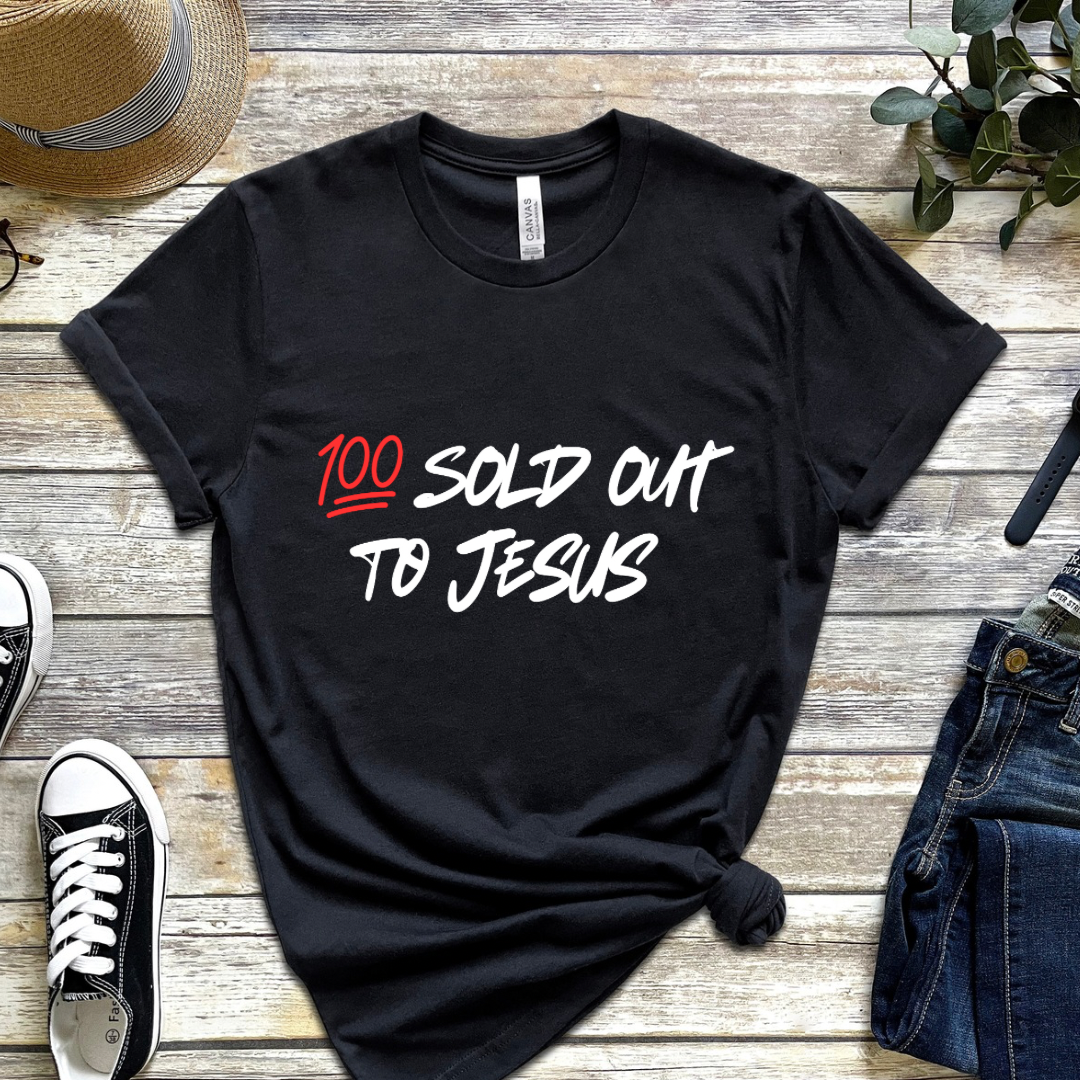 Black crewneck t-shirt that says, “sold out to Jesus” with a “100 emoji”.