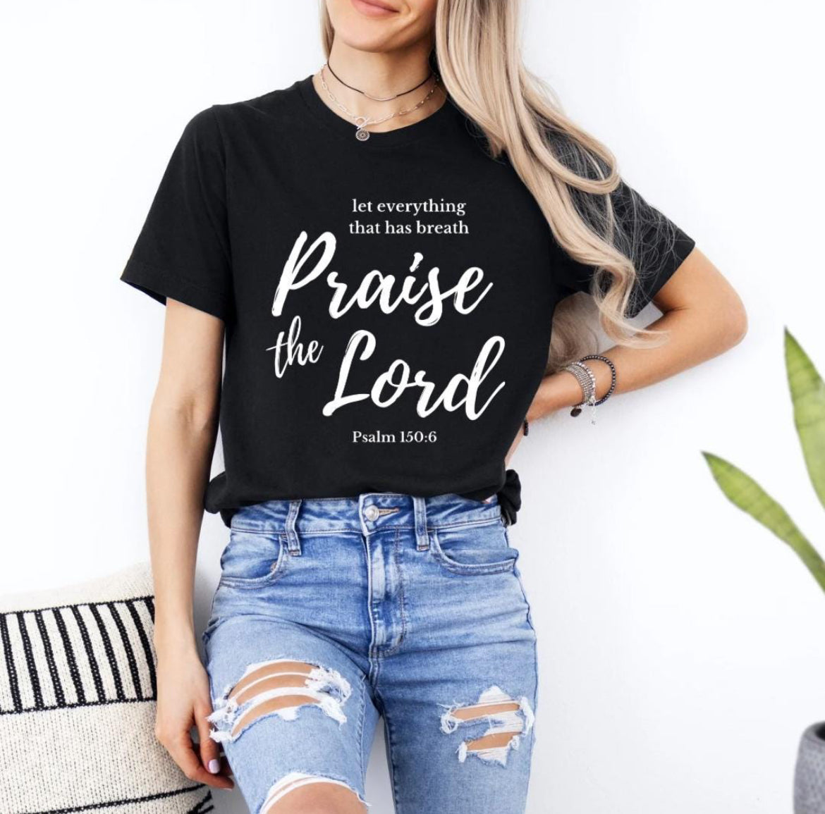 Black crewneck t-shirt that says, “let everything that has breath praise the Lord” underneath in small letters it says, “Psalm 150 6.”