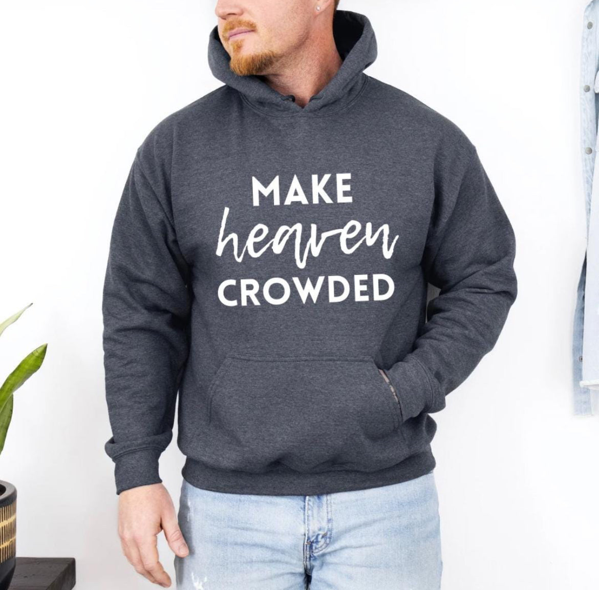 Dark grey hoodie that says, "Make heaven crowded."