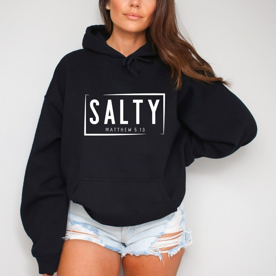 Black hoodie sweatshirt that says, “SALTY” in large capital letters. Underneath in smaller letters it says, “Matthew 5:13.”